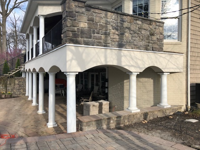 cement board system supporting a covered balcony