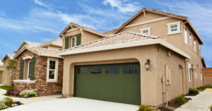 large brown house with a well-maintained stucco exterior
