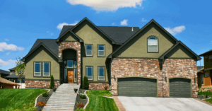 Exterior of a home with a green stucco paint job
